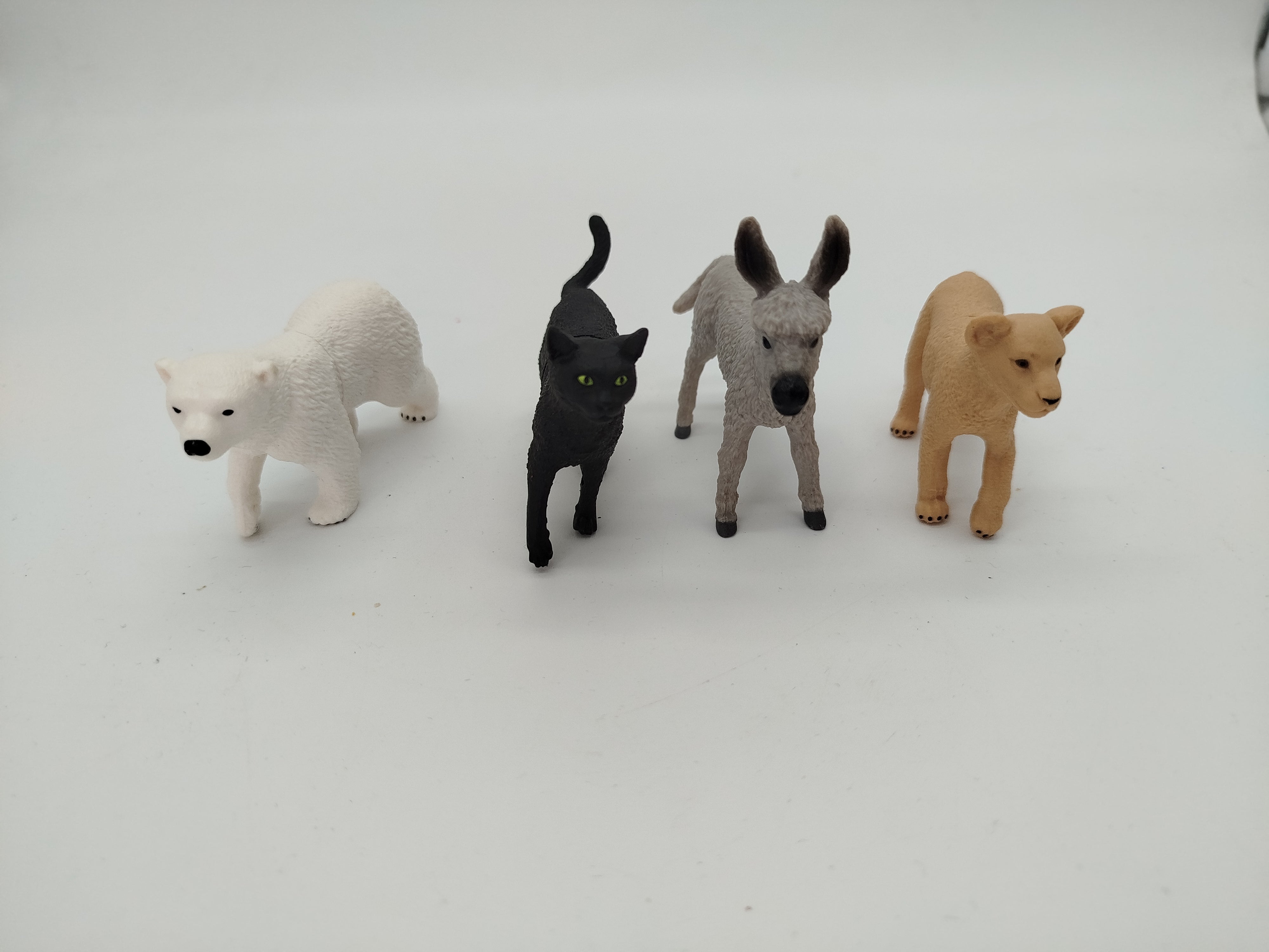 Schleich Puzzlemals Set von 4 – Eisbär, Katze, Esel, Löwenjunges